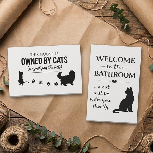 Cat canvas set, Bathroom and White & Black Owned By Cats, side by side on kraft paper