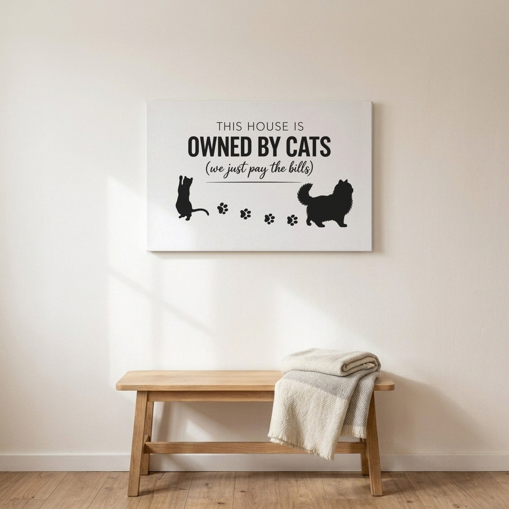 White This House Is Owned By Cats canvas above a wooden bench