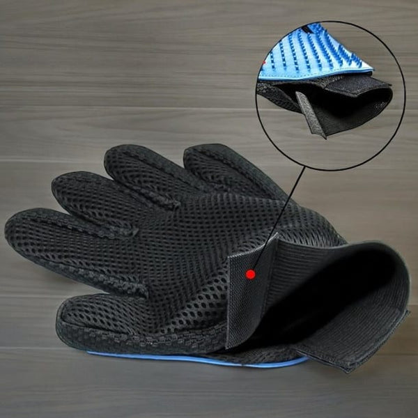 Pet grooming glove lifting loose fur from a pet's coat