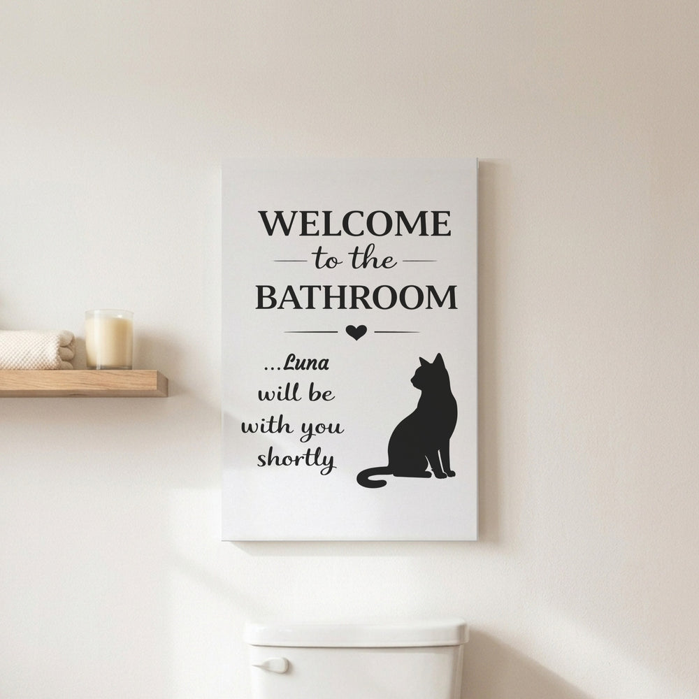 Personalized Welcome to the Bathroom canvas for Luna above a toilet in a white bathroom