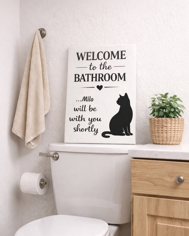 Personalized cat bathroom canvas with the name Milo above a toilet