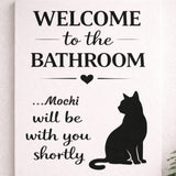 Close-up of a personalized cat bathroom canvas with the name Mochi