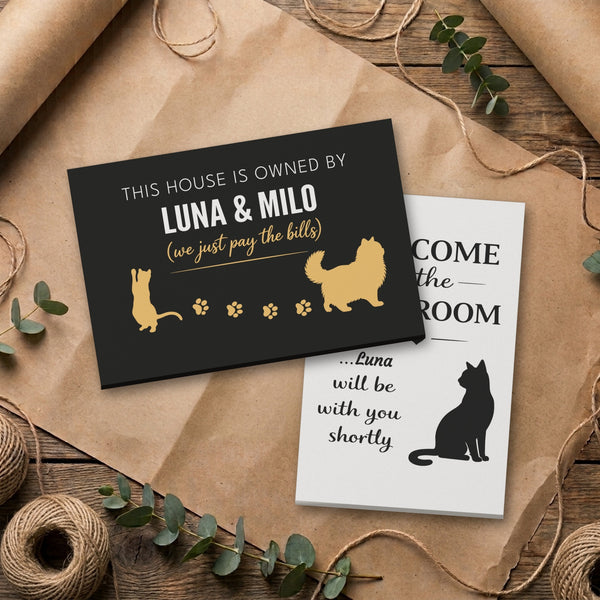Personalized cat canvas set: Owned By Luna & Milo canvas stacked on the Luna bathroom canvas, on kraft paper