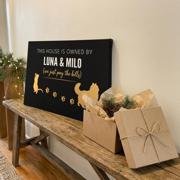 Personalized cat name canvas gift reading This house is owned by Luna & Milo next to a wrapped present