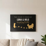 Personalized Owned By Cats canvas, Black & Gold, reading This house is owned by Luna & Milo, above a living room sofa